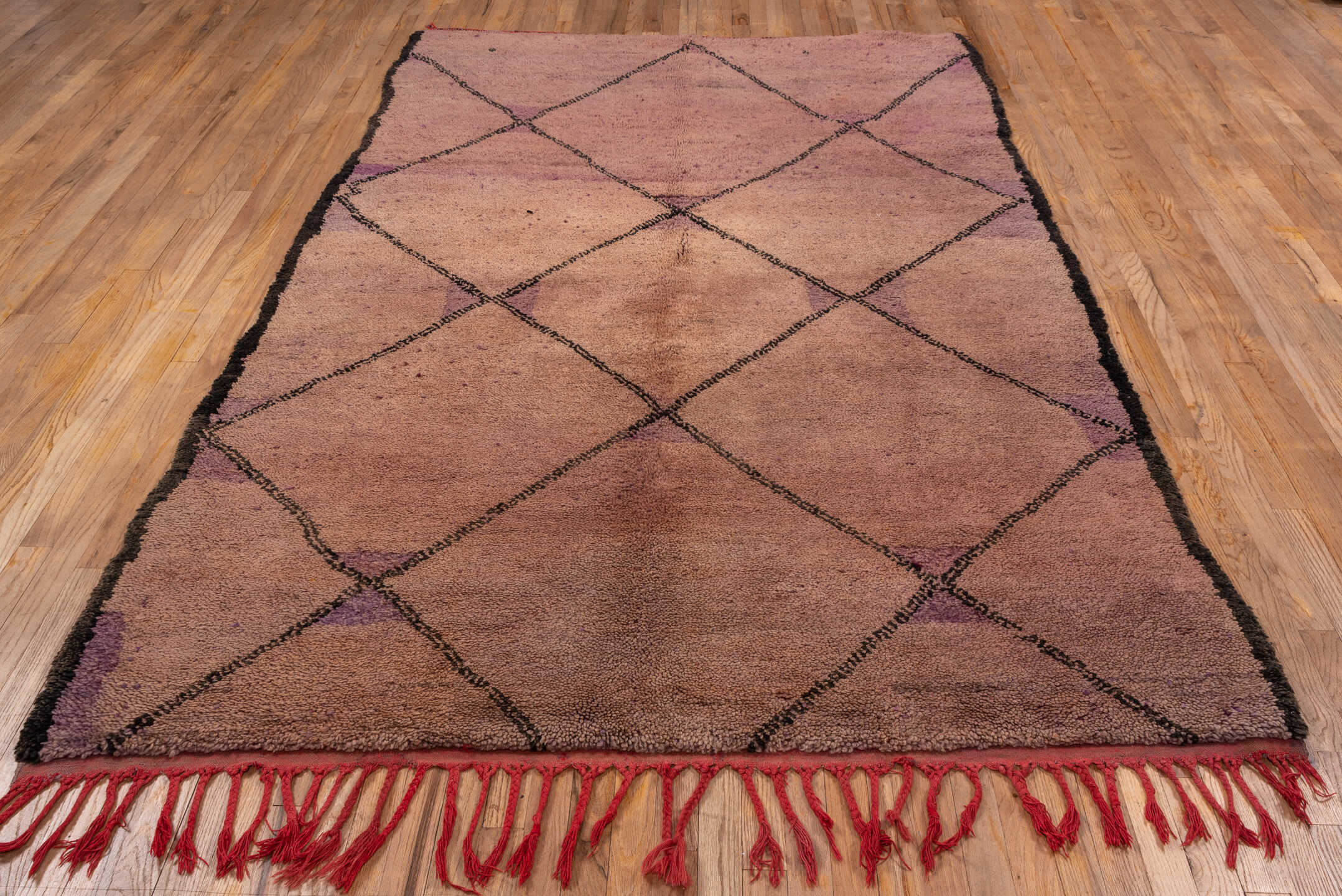 5' x 9' one-of-a-kind handmade vintage Moroccan medium size rug. Color palette: brown, pink, gray, light gray, red, black