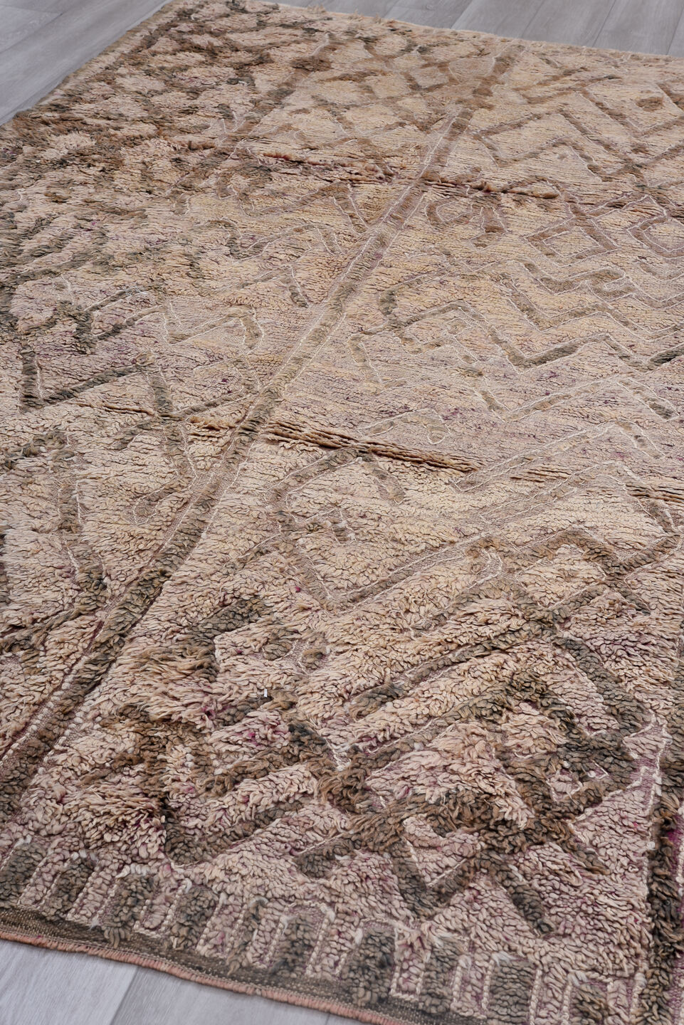 5' x 10' one-of-a-kind handmade vintage Moroccan medium size rug. Color palette: gray, pink, light gray, off-white, brown
