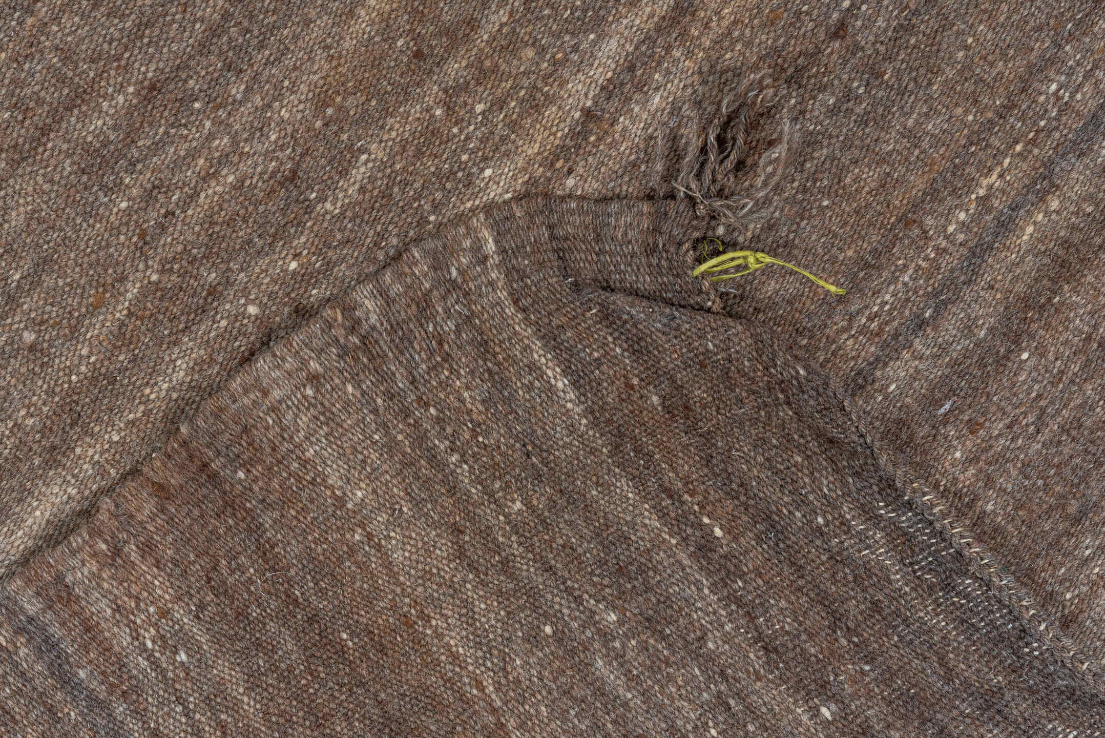 4' x 9' one-of-a-kind handmade vintage runner rug. Color palette: brown, gray, light gray, off-white, pink, snow, white