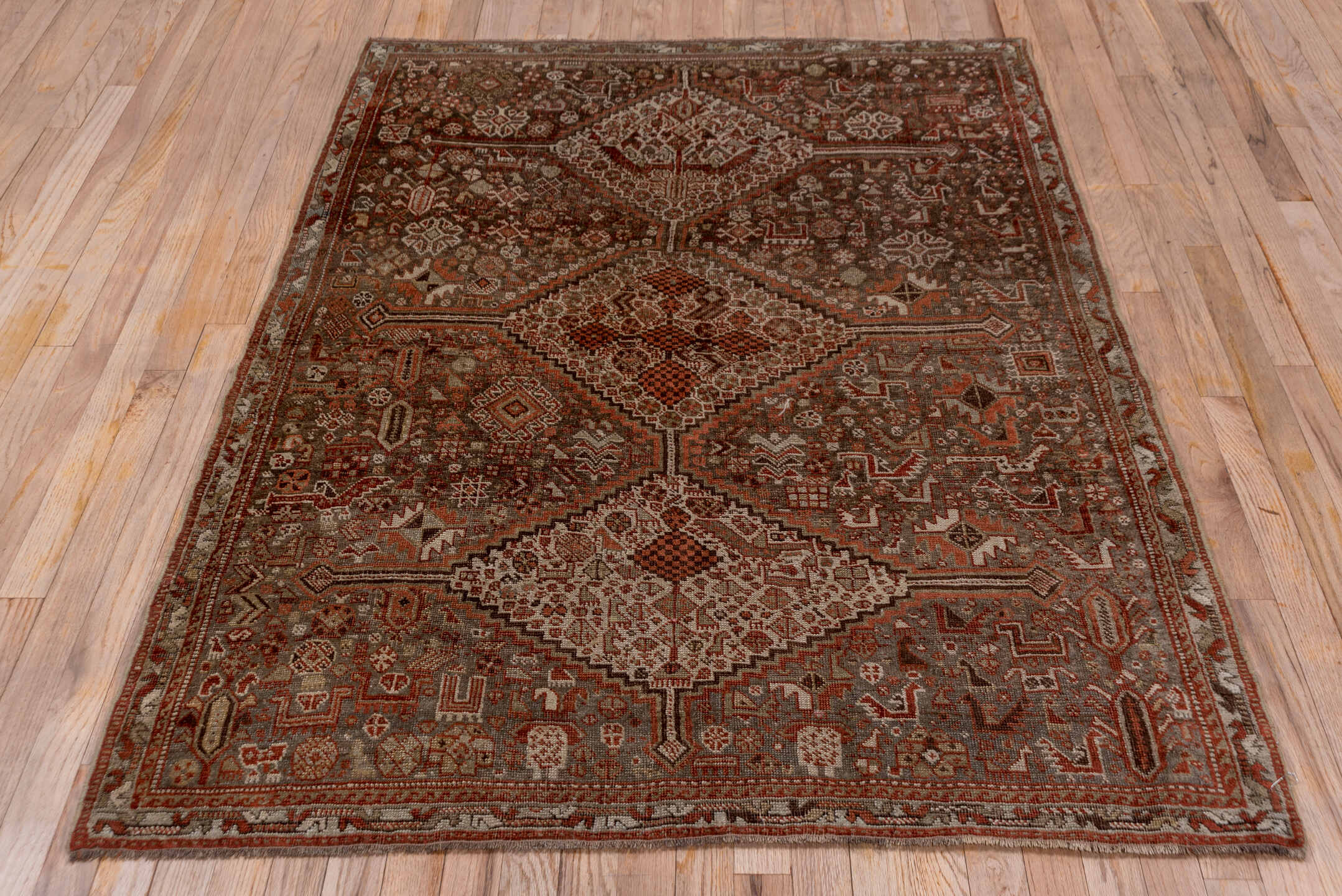 4' x 5' one-of-a-kind handmade vintage Shiraz small size rug. Color palette: gray, pink, brown
