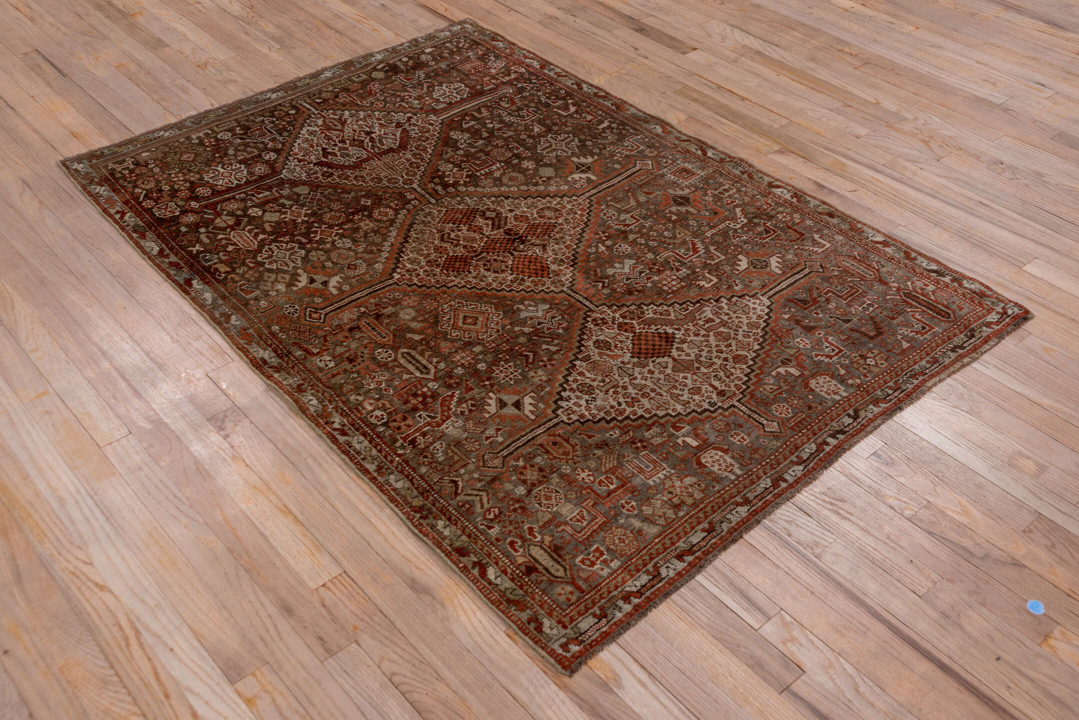 4' x 5' one-of-a-kind handmade vintage Shiraz small size rug. Color palette: gray, pink, brown