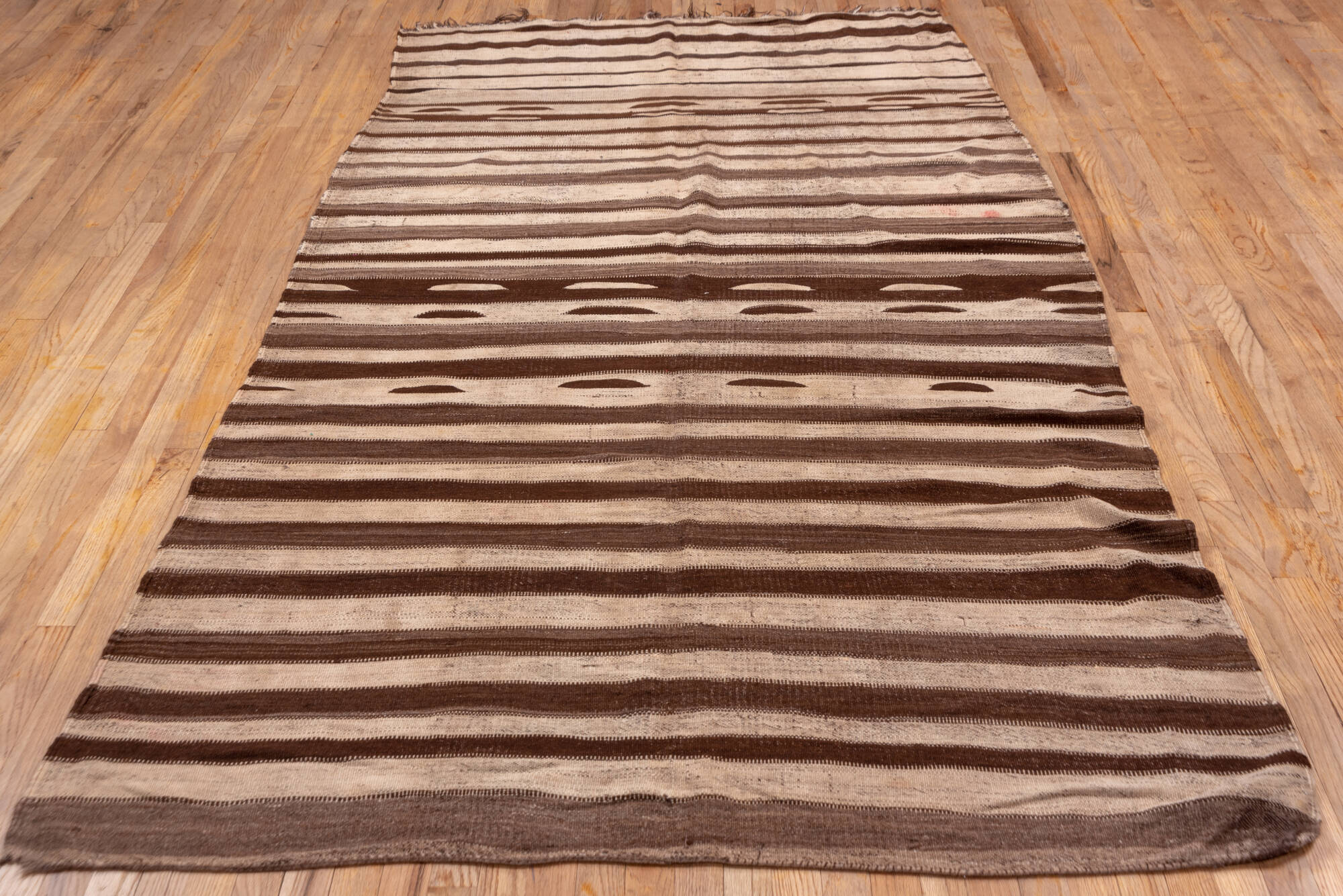 5' x 11' one-of-a-kind handmade vintage Kilim runner rug. Color palette: brown, gray, light gray, off-white, pink, redwood