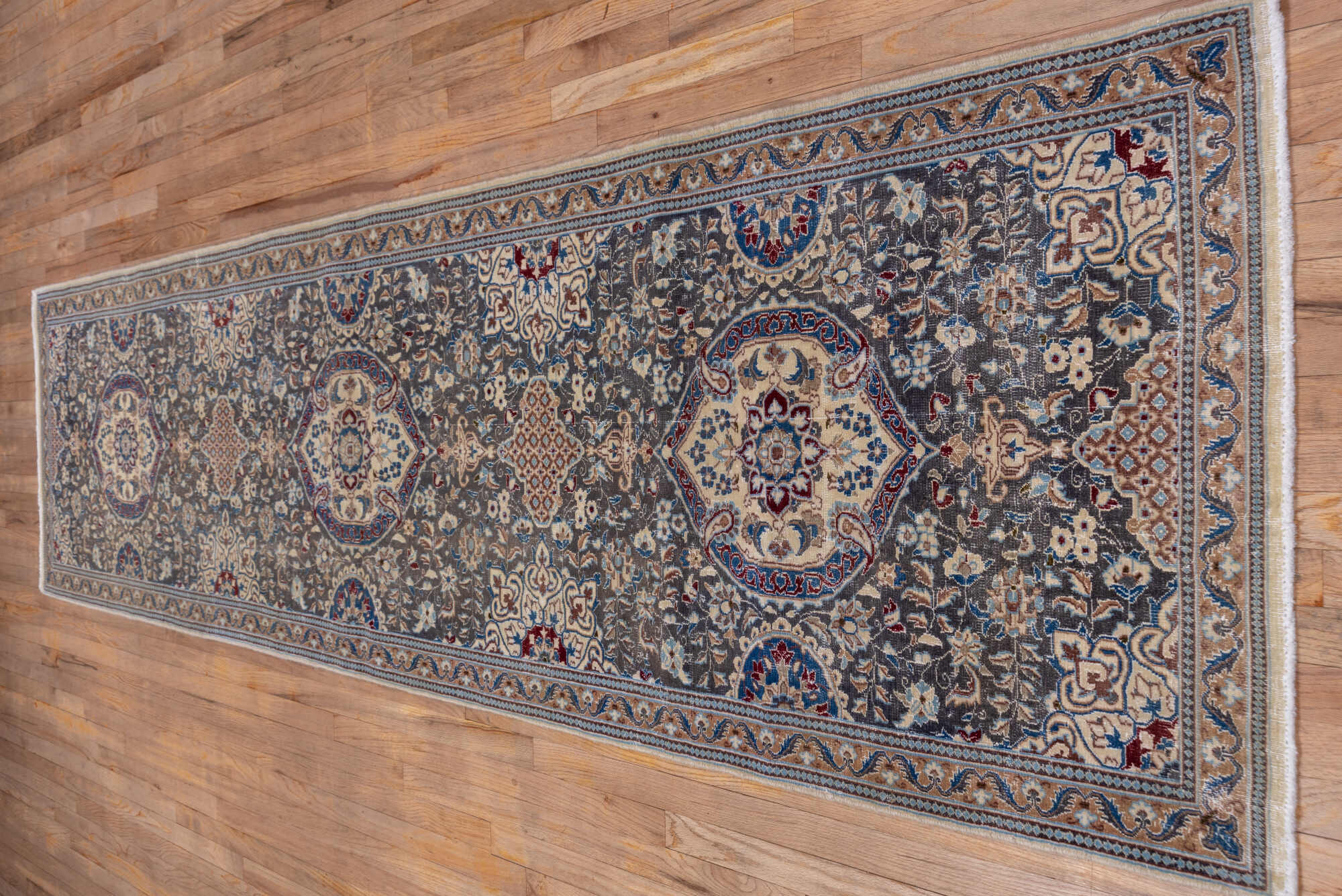 3' x 12' one-of-a-kind handmade vintage Naiin runner rug. Color palette: blue, brown, dark gray, gray, light blue