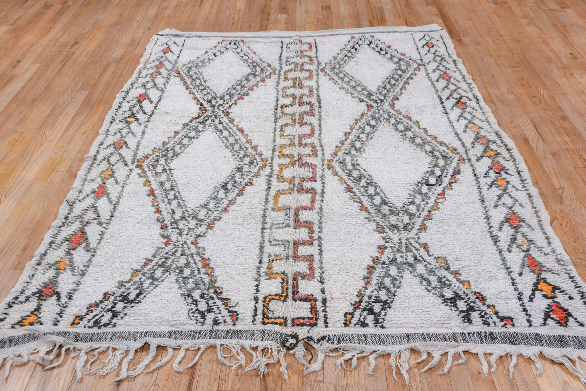 5' x 8' one-of-a-kind handmade vintage Moroccan medium size rug. Color palette: black, brown, charcoal, dark gray, dim gray