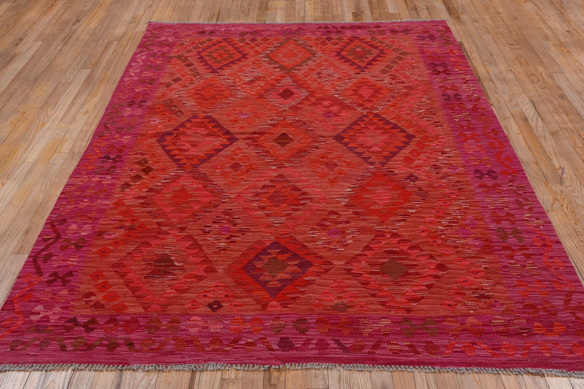 5' x 8' one-of-a-kind handmade vintage Kilim medium size rug. Color palette: brown, dark red, indian red, pink, red