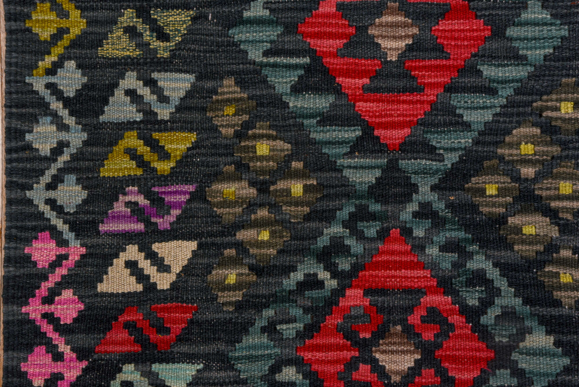 2' x 8' one-of-a-kind handmade vintage Kilim runner rug. Color palette: black, blue, brown, burgundy, gray, pink, red