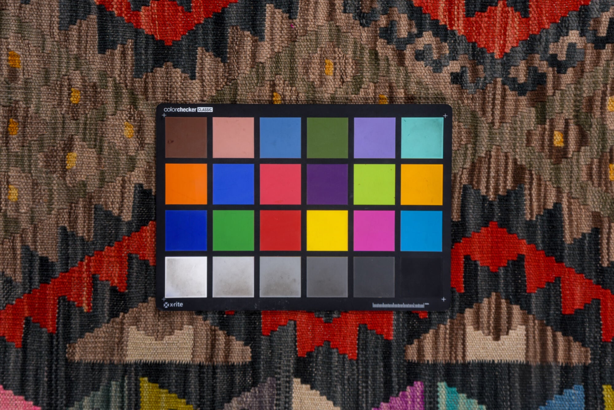 5' x 6' one-of-a-kind handmade vintage Kilim rug. Color palette: black, blue, brown, charcoal, dim gray, gray, pink, red