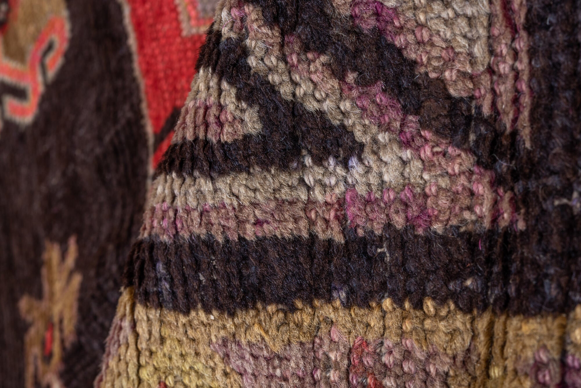 5' x 8' one-of-a-kind handmade vintage Khotan medium size rug. Color palette: black, brown, gray, pink, red