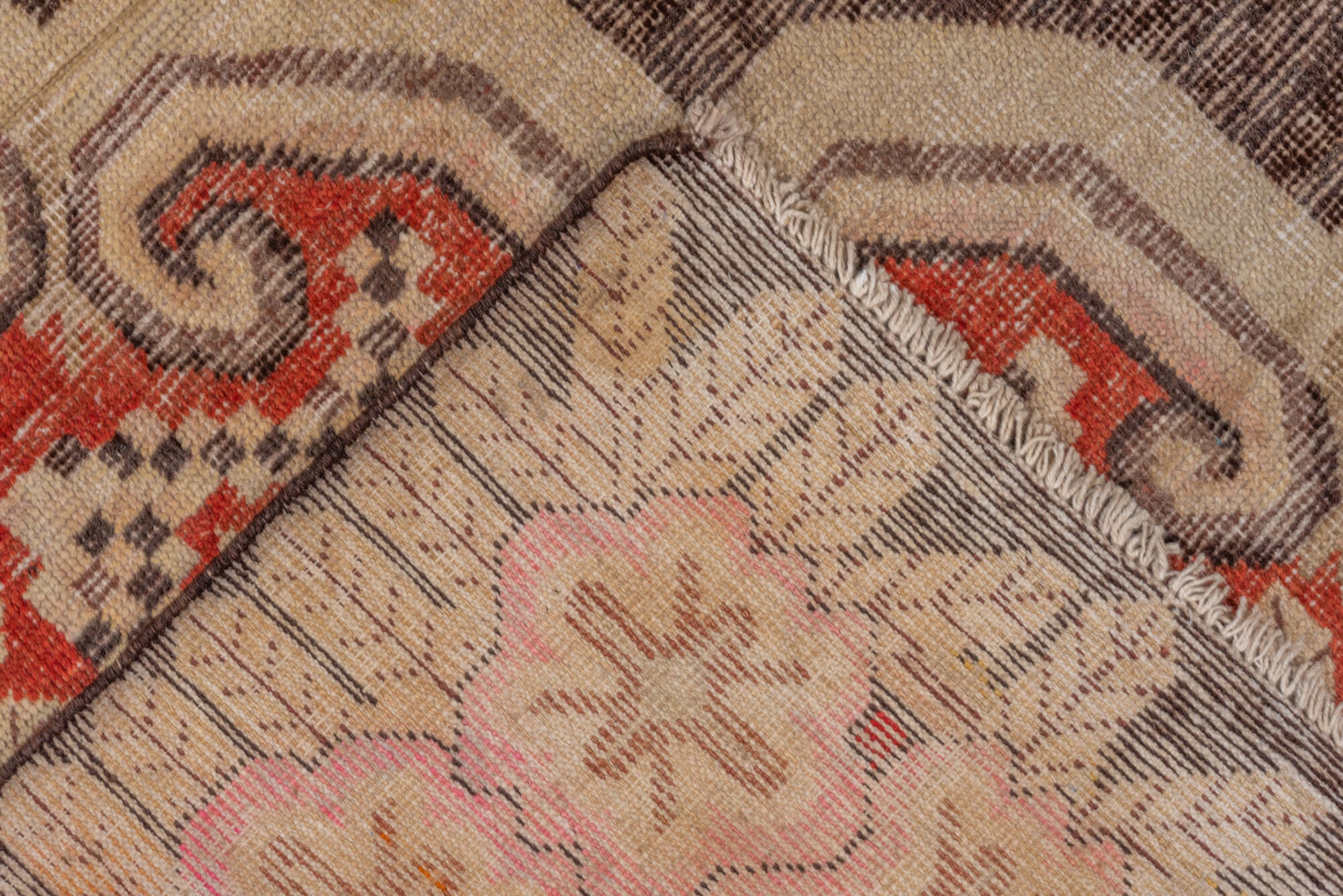 5' x 8' one-of-a-kind handmade vintage Khotan medium size rug. Color palette: brown, dark red, off-white, orange, red, tan