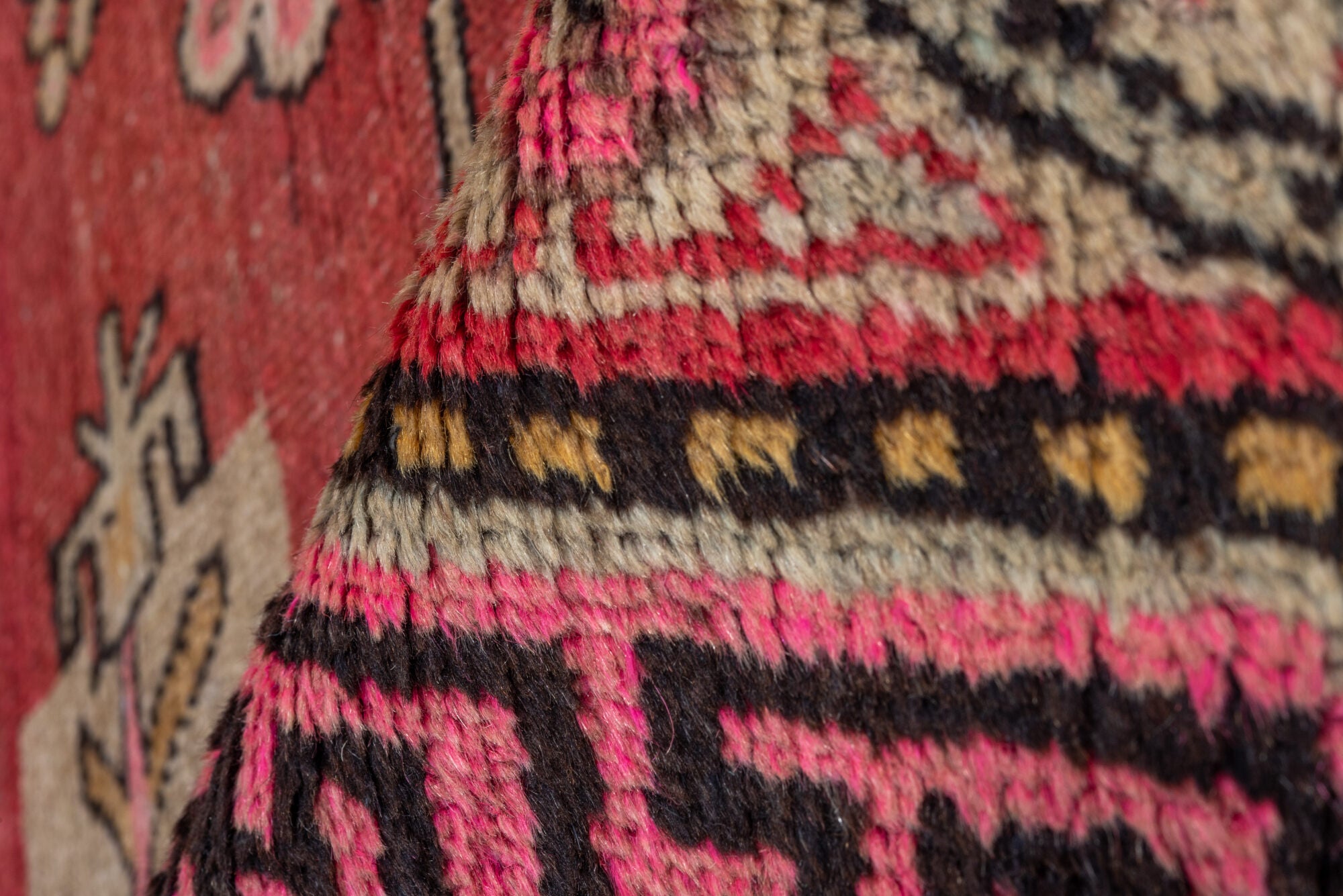 4' x 8' one-of-a-kind handmade vintage Khotan rug. Color palette: black, brown, pink, red