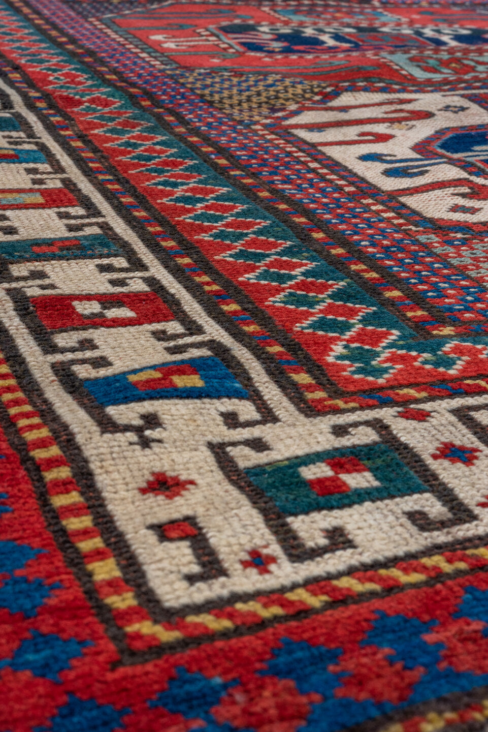 4' x 4' one-of-a-kind handmade vintage Kazak small size rug. Color palette: off-white, gray, brown, blue, red, light gray