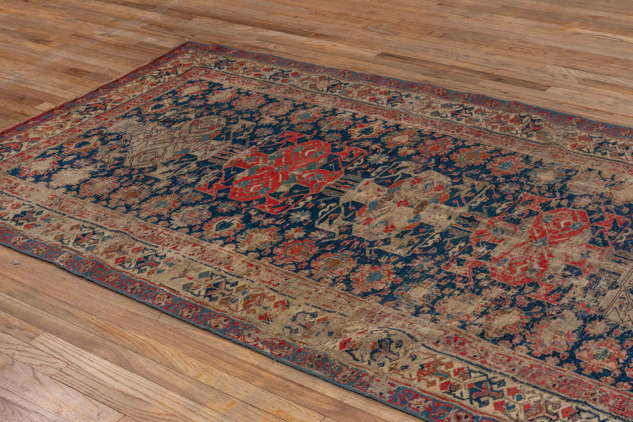 5' x 9' one-of-a-kind handmade vintage Sumak medium size rug. Color palette: brown, red, gray, black, blue, pink, charcoal