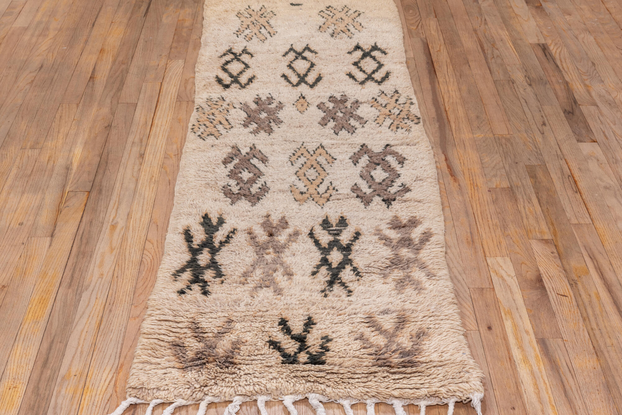 2' x 7' one-of-a-kind handmade vintage Moroccan runner rug. Color palette: black, brown, gray, light gray, off-white, pink