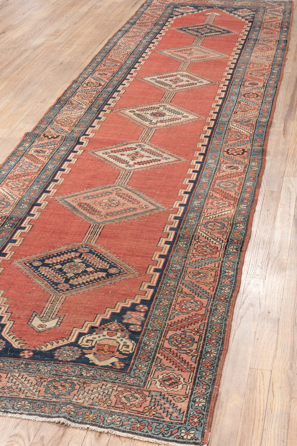 3' x 12' one-of-a-kind handmade vintage Serapi runner rug. Color palette: gray, pink, red, off-white, light gray, black