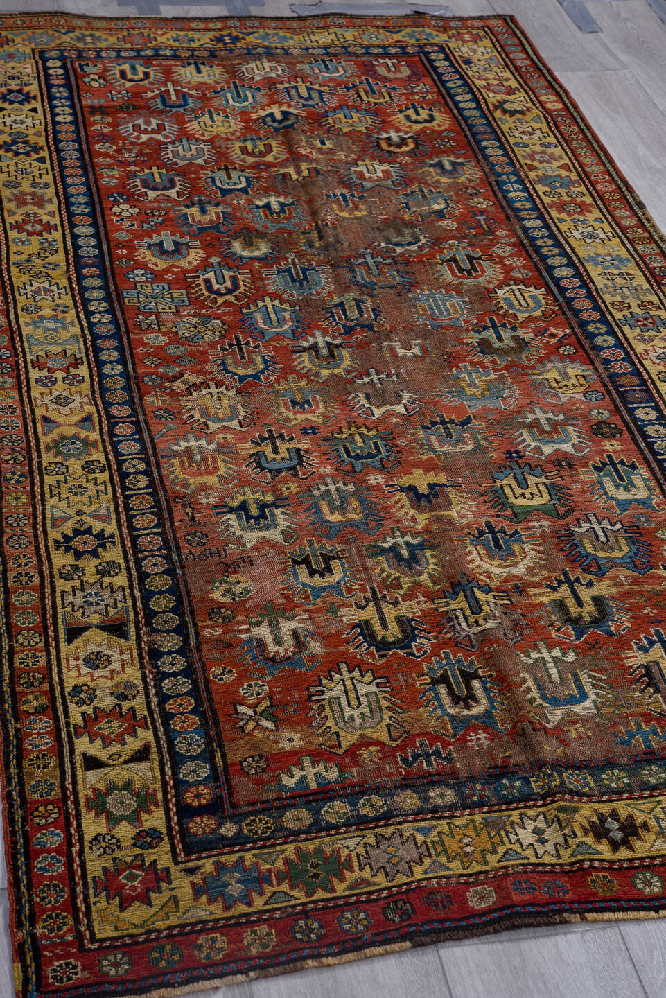 3' x 7' one-of-a-kind handmade vintage Sumak rug. Color palette: brown, yellow, blue, gray, off-white, red, orange, arapawa