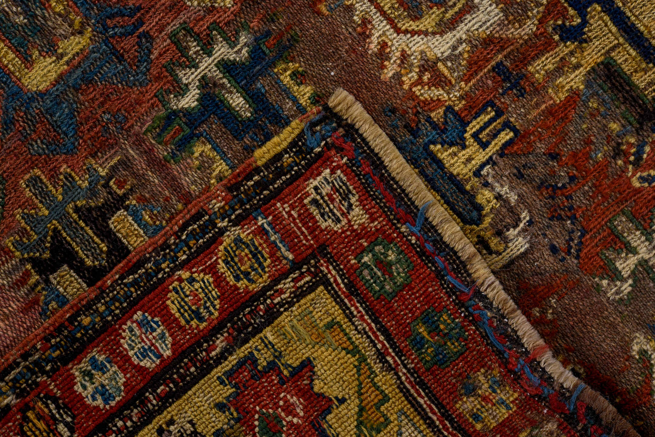 3' x 7' one-of-a-kind handmade vintage Sumak rug. Color palette: brown, yellow, blue, gray, off-white, red, orange, arapawa