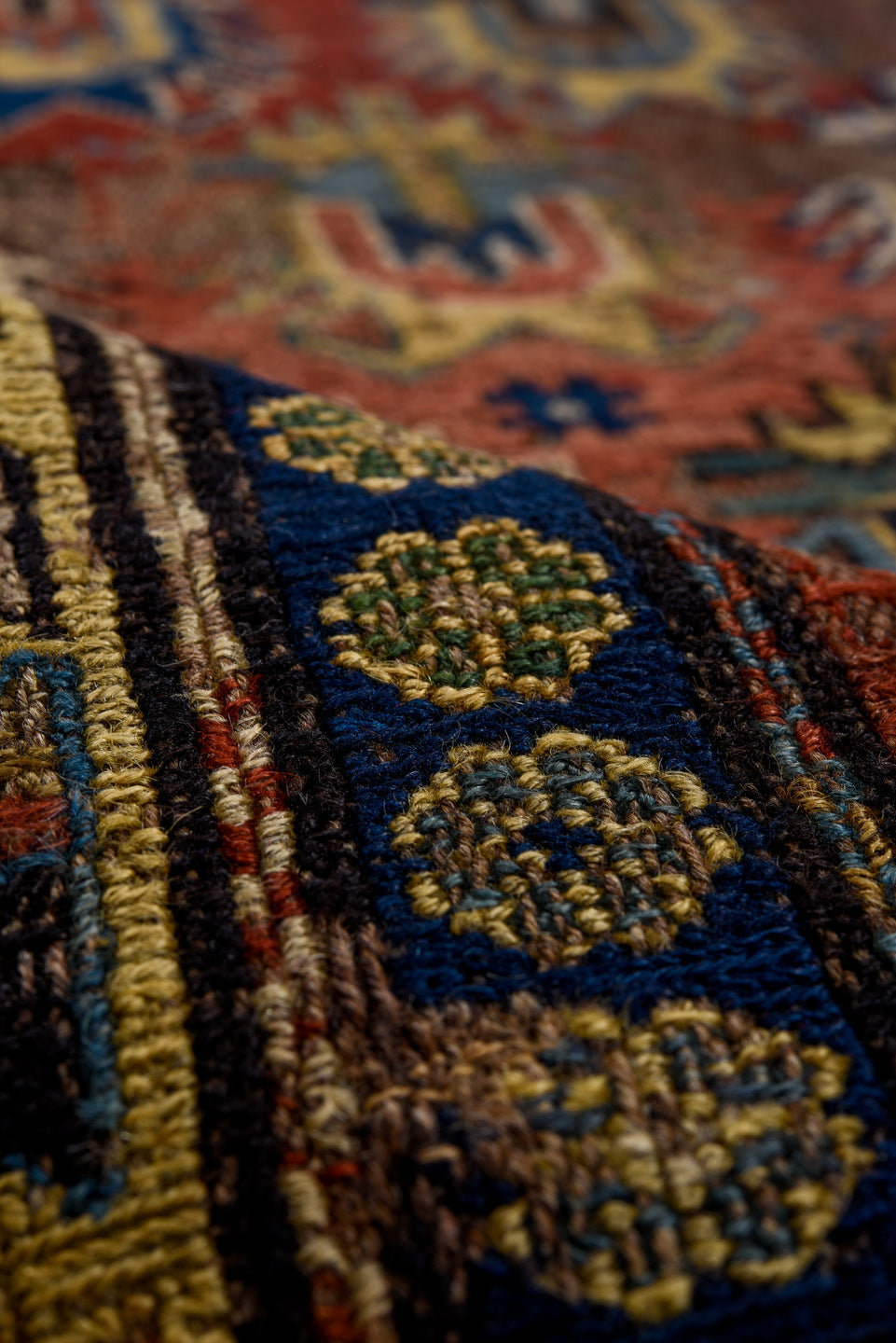 3' x 7' one-of-a-kind handmade vintage Sumak rug. Color palette: brown, yellow, blue, gray, off-white, red, orange, arapawa