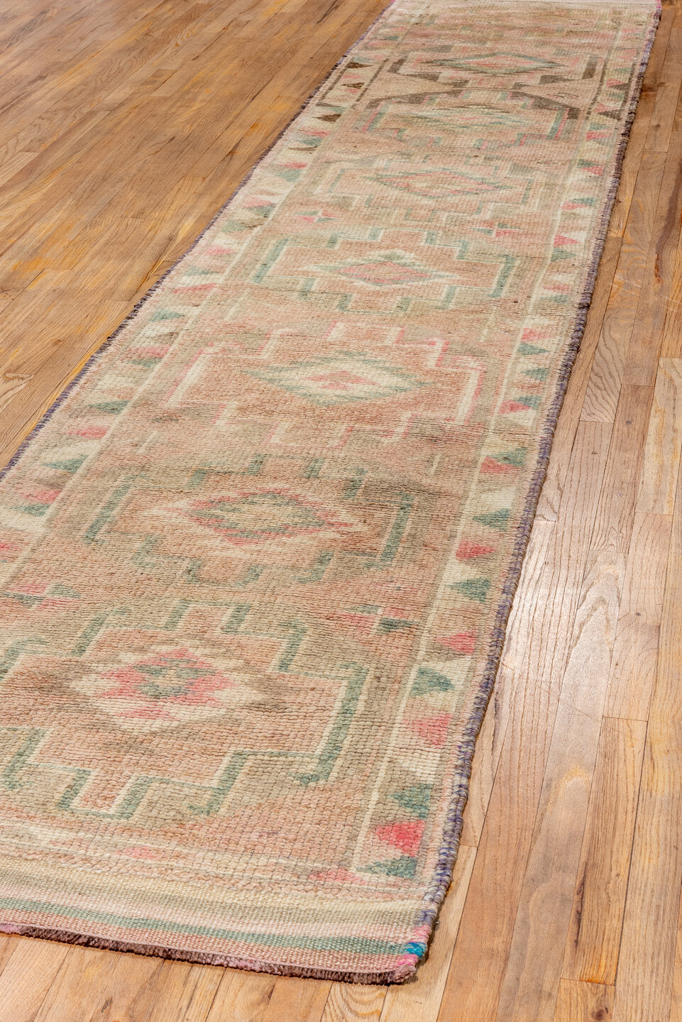 2' x 10' one-of-a-kind handmade vintage Kars runner rug. Color palette: off-white, orange, brown, gray, pink, white, snow