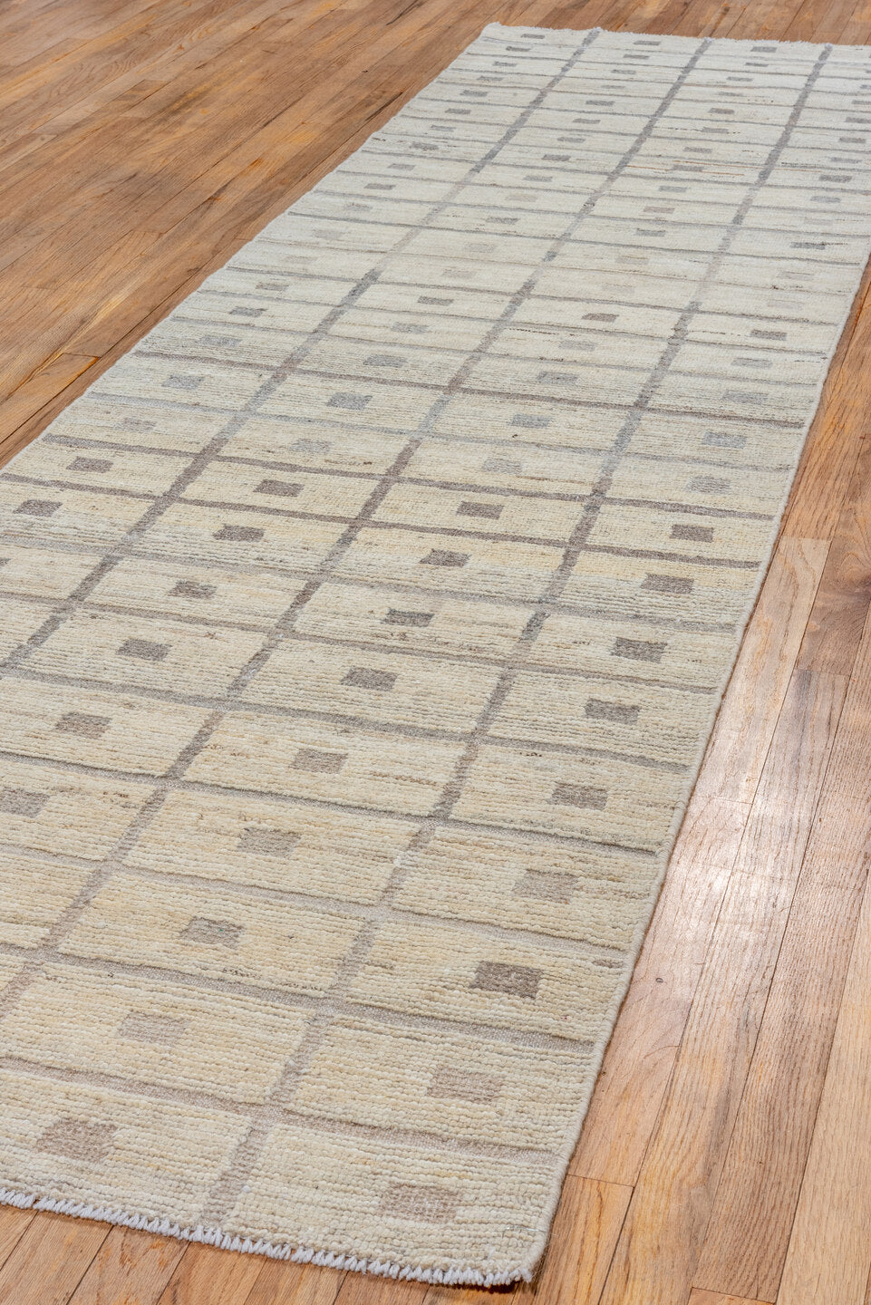 3' x 11' one-of-a-kind handmade vintage Tulu runner rug. Color palette: light gray, gray, off-white, pink, white, snow