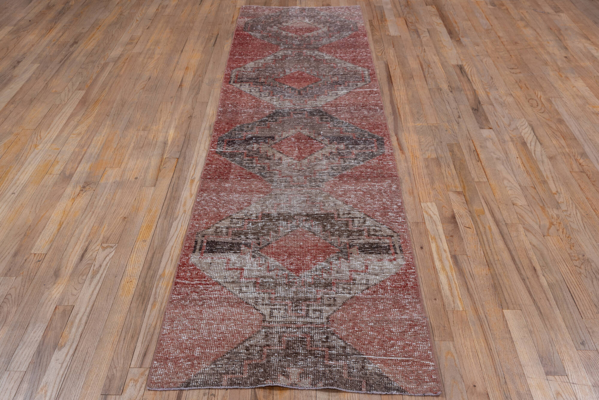 2' x 10' one-of-a-kind handmade vintage Oushak runner rug. Color palette: brown, gray, light gray, off-white, pink, red