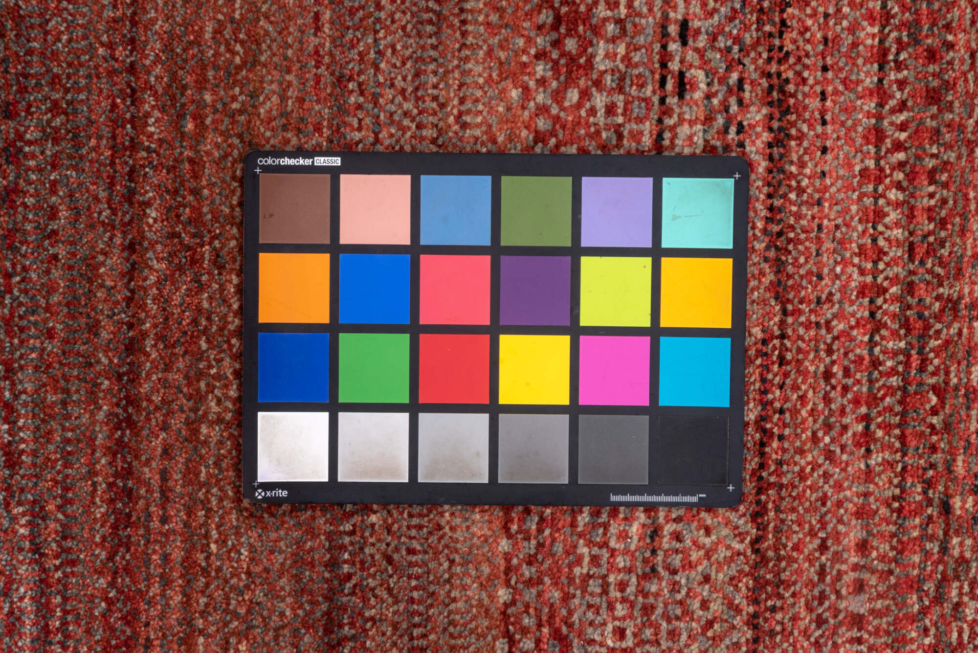 2' x 10' one-of-a-kind handmade vintage Gabbe runner rug. Color palette: brown, off-white, pink, red, redwood, snow, white