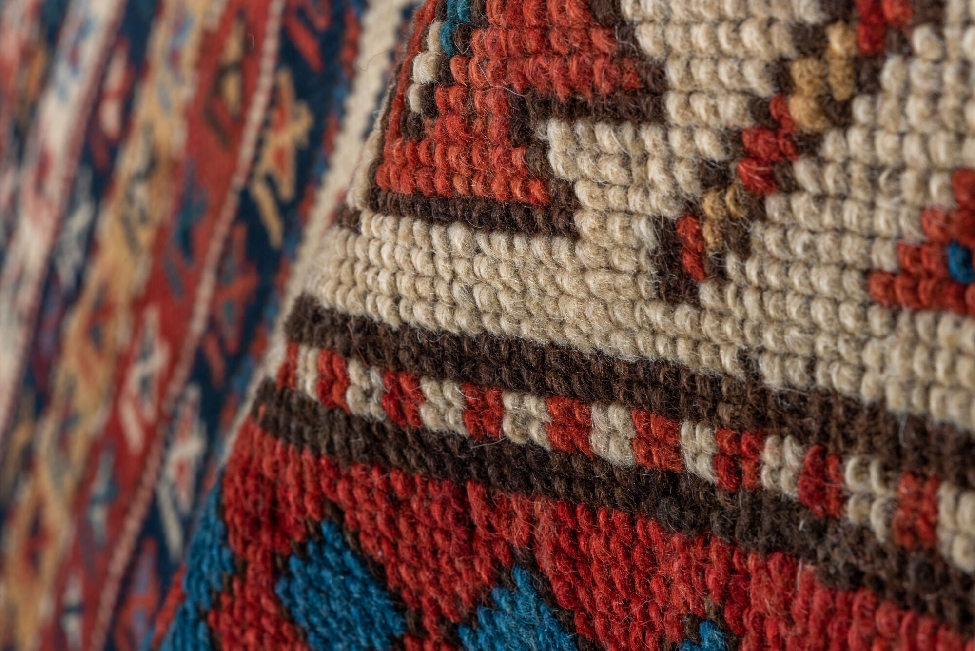 4' x 9' one-of-a-kind handmade vintage Kazak runner rug. Color palette: arapawa, black, blue, brown, gray, orange, red, tan