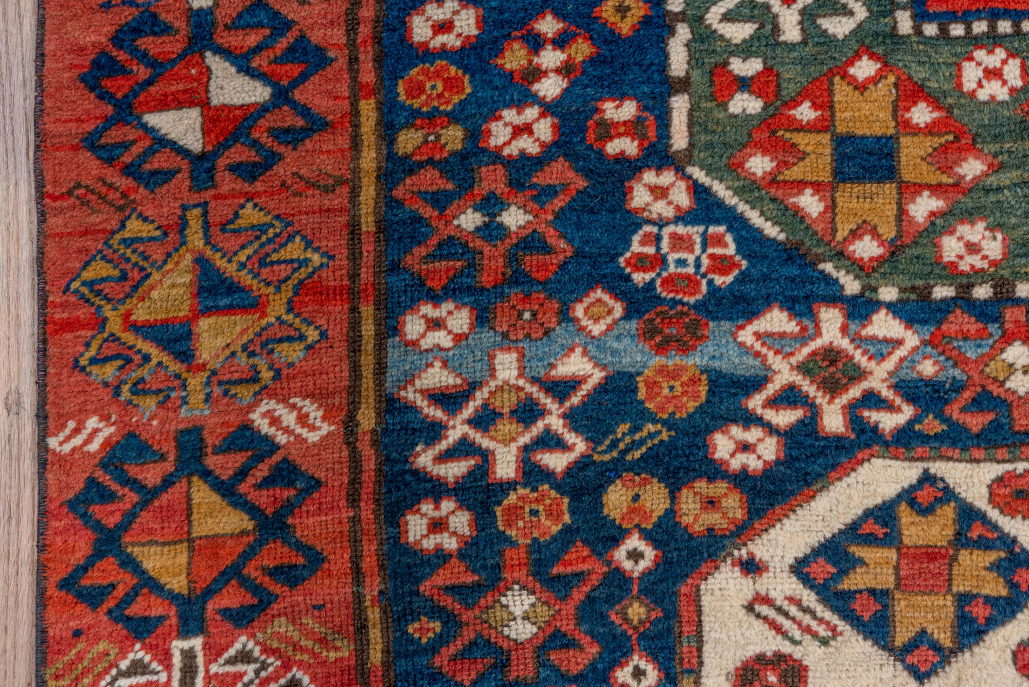 4' x 6' one-of-a-kind handmade vintage Kazak small size rug. Color palette: blue, brown, gray, pink, red