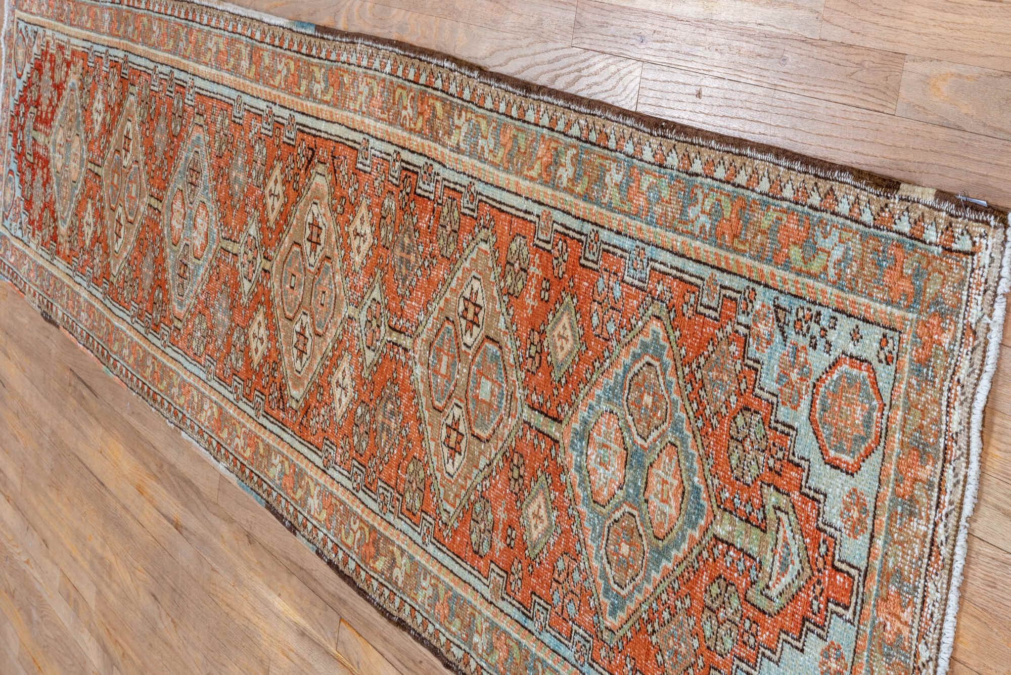 2' x 10' one-of-a-kind handmade vintage Heriz runner rug. Color palette: brown, dark gray, gray, light gray, off-white, pink