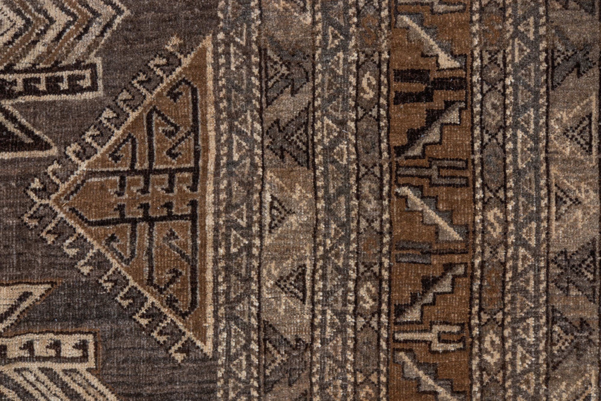 7' x 9' one-of-a-kind handmade vintage Afghan rug. Color palette: black, brown, charcoal, gray, light gray, off-white, pink