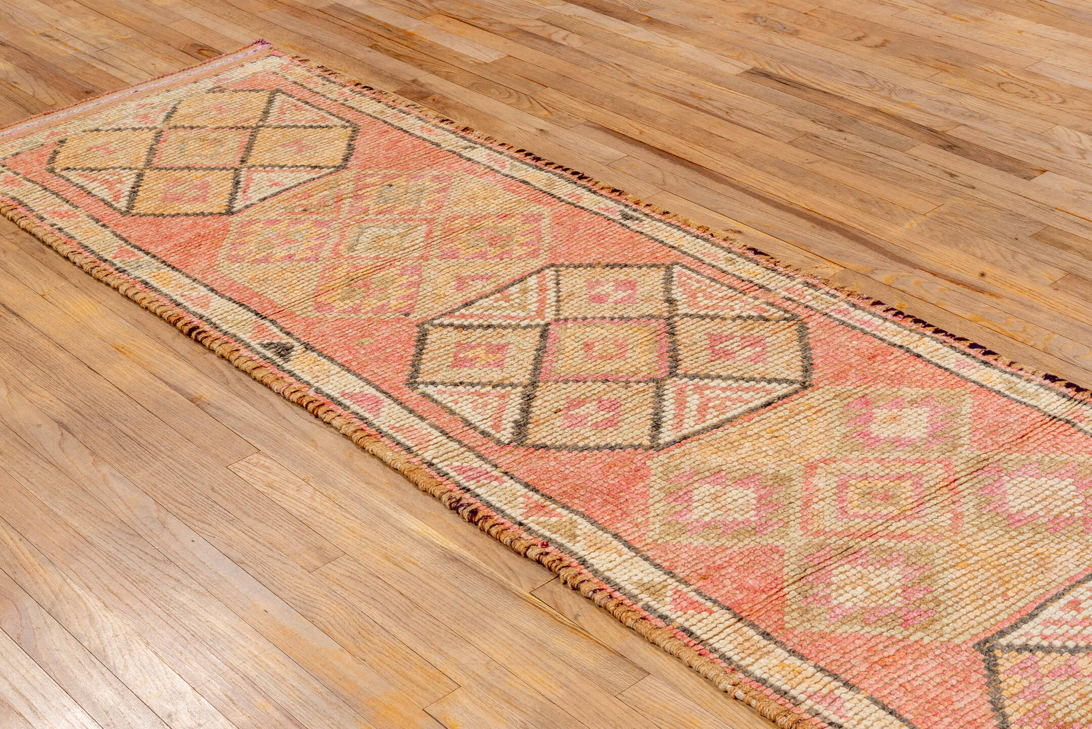 2' x 10' one-of-a-kind handmade vintage Oushak runner rug. Color palette: brown, red, pink, orange, off-white, dark salmon