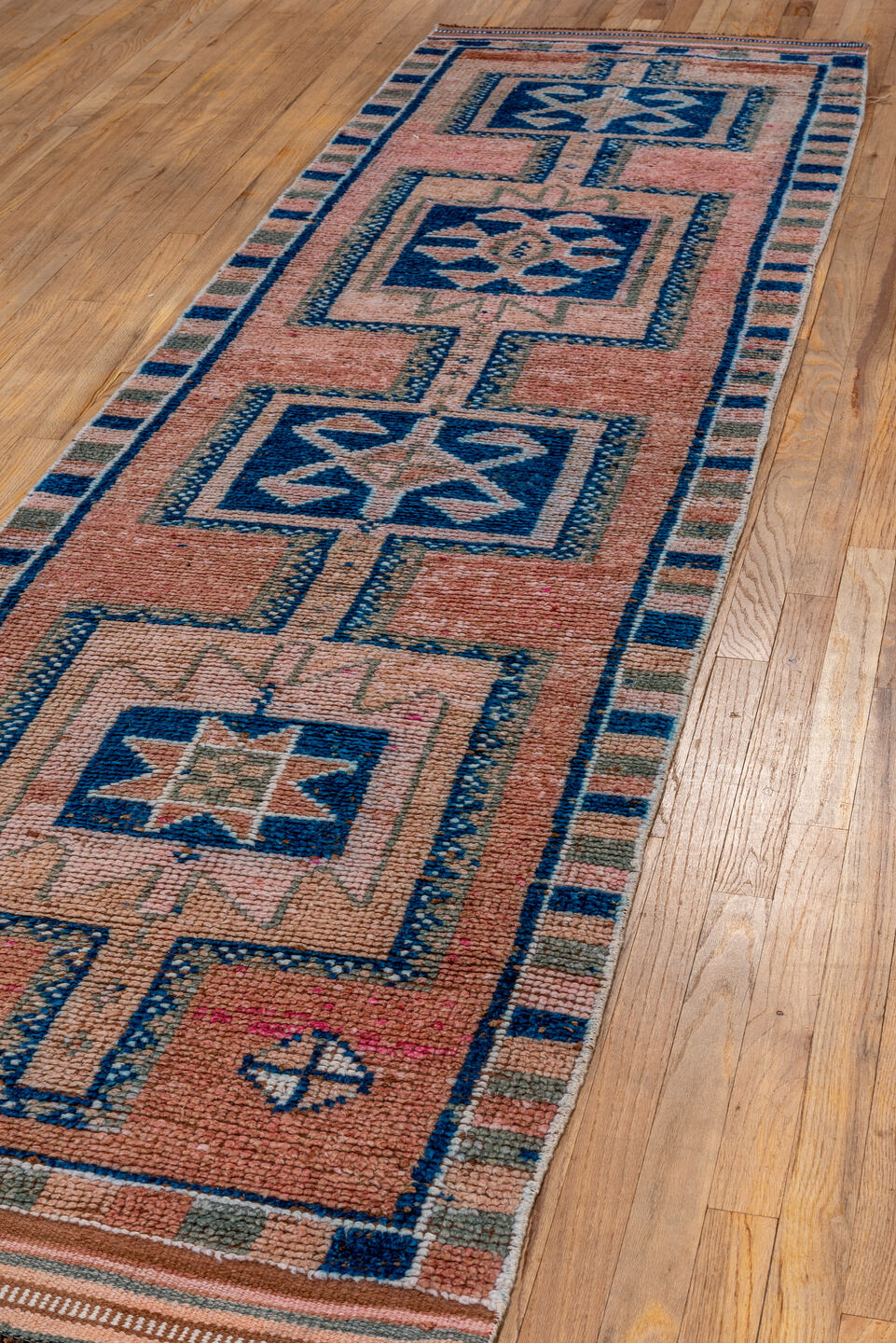 2' x 11' one-of-a-kind handmade vintage Kars runner rug. Color palette: brown, pink, gray, blue, black, light blue