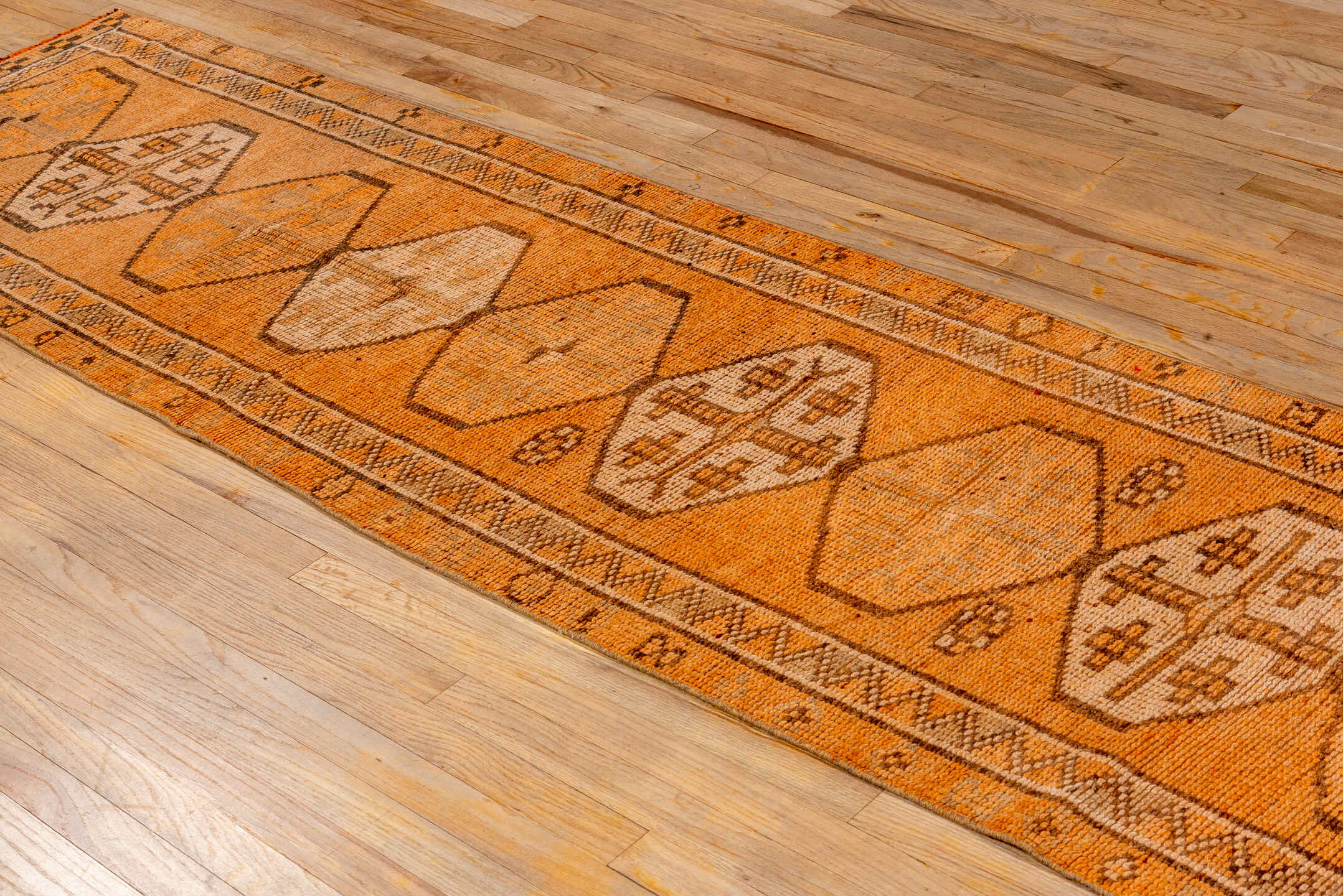 2' x 12' one-of-a-kind handmade vintage Oushak runner rug. Color palette: brown, pink, orange, off-white, white, snow