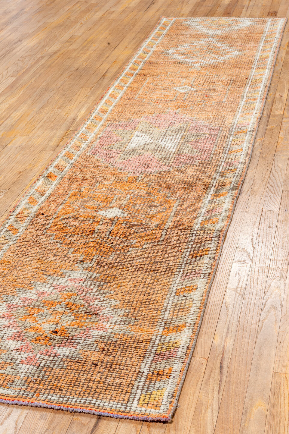 2' x 11' one-of-a-kind handmade vintage Oushak runner rug. Color palette: brown, pink, off-white, light gray, gray, orange