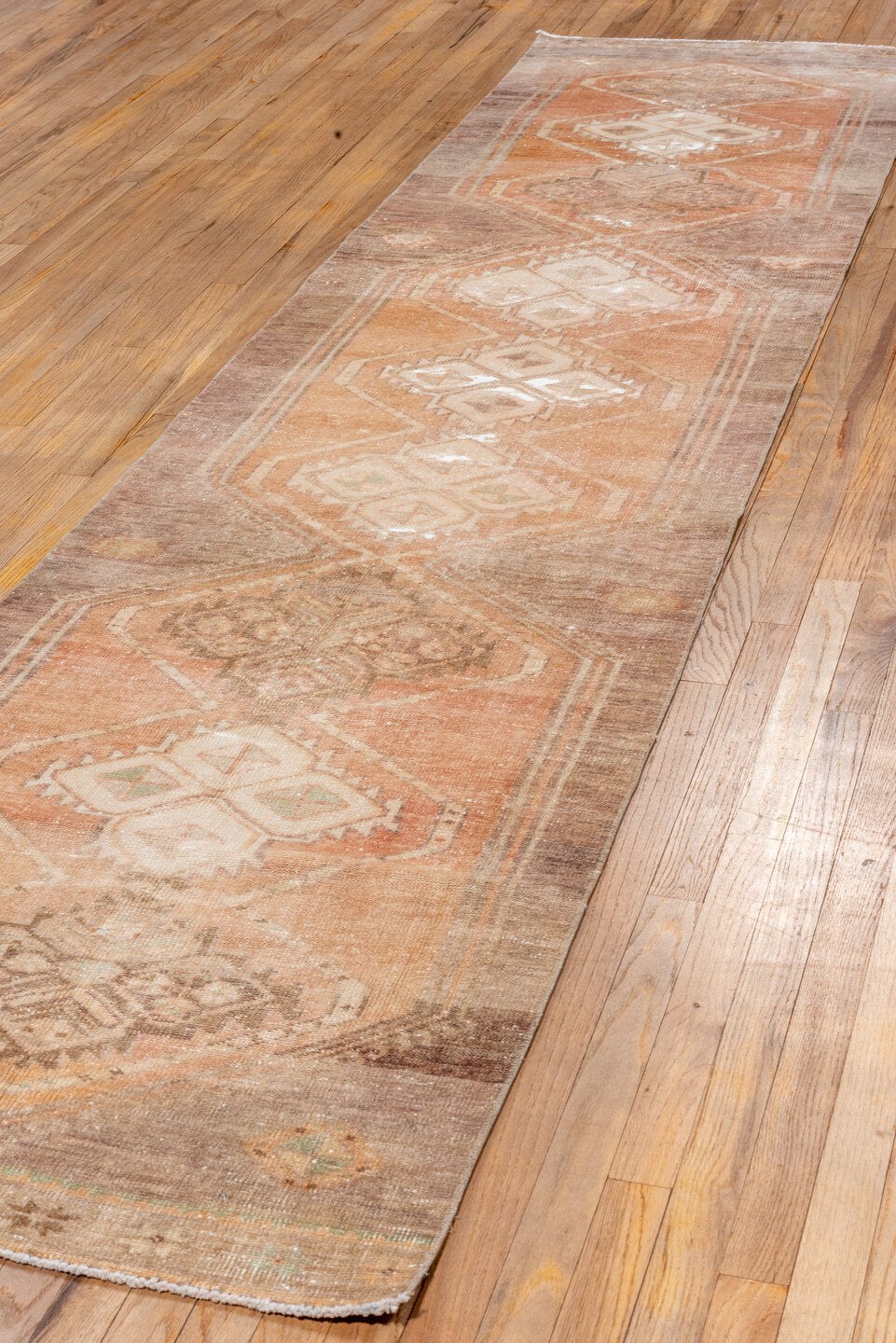 2' x 12' one-of-a-kind handmade vintage Oushak runner rug. Color palette: pink, brown, off-white, orange, white, snow