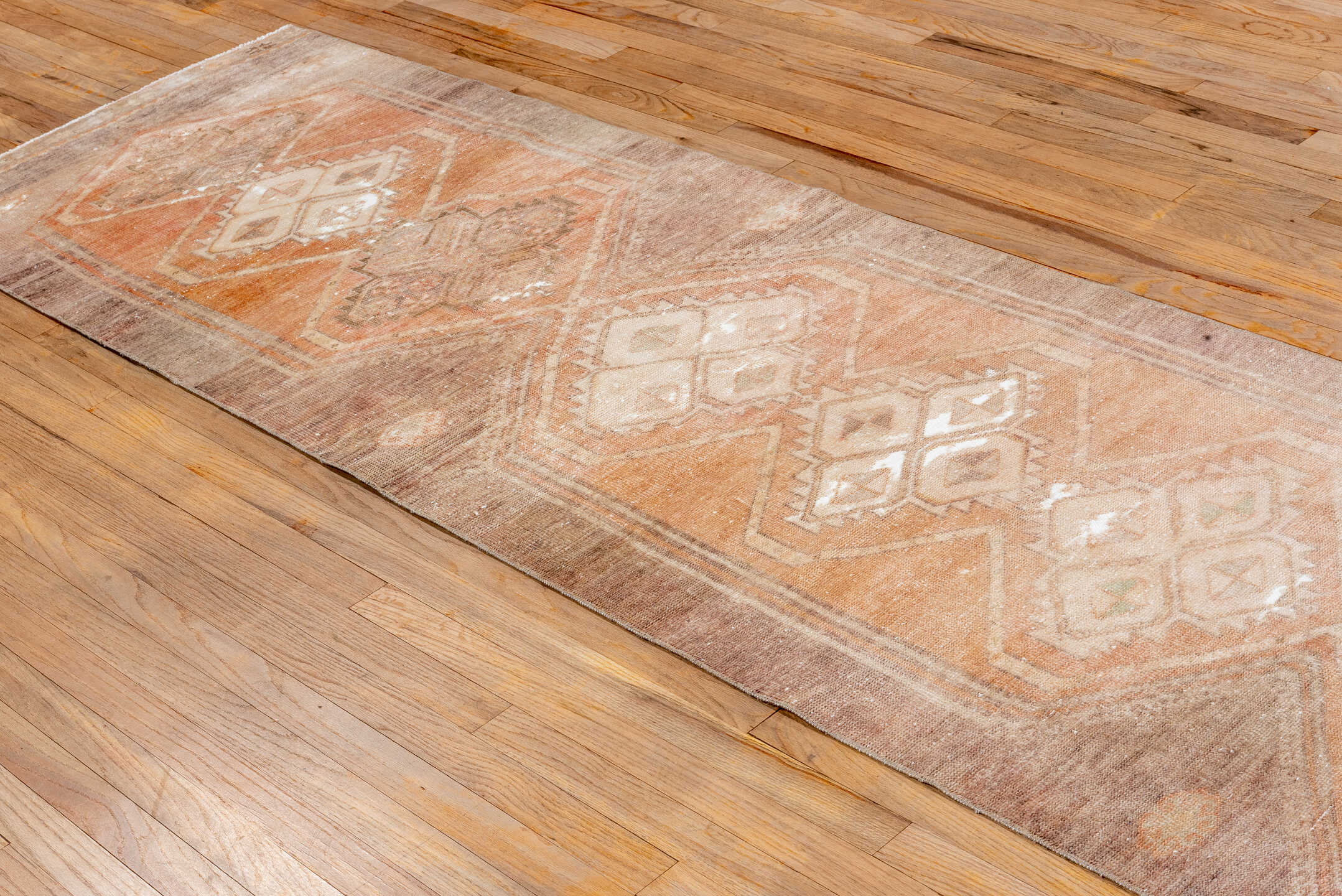 2' x 12' one-of-a-kind handmade vintage Oushak runner rug. Color palette: pink, brown, off-white, orange, white, snow