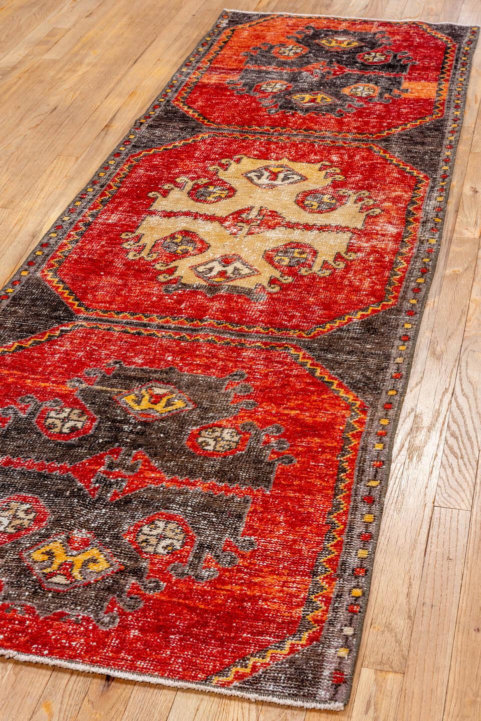 2' x 8' one-of-a-kind handmade vintage Oushak runner rug. Color palette: red, brown, pink, orange, gray, black, off-white