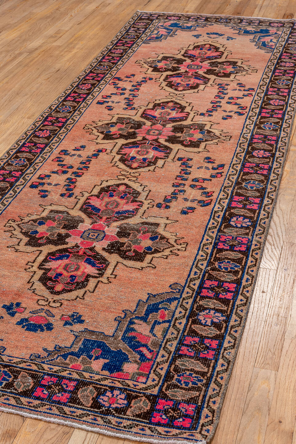 3' x 10' one-of-a-kind handmade vintage Oushak runner rug. Color palette: brown, red, pink, gray, blue