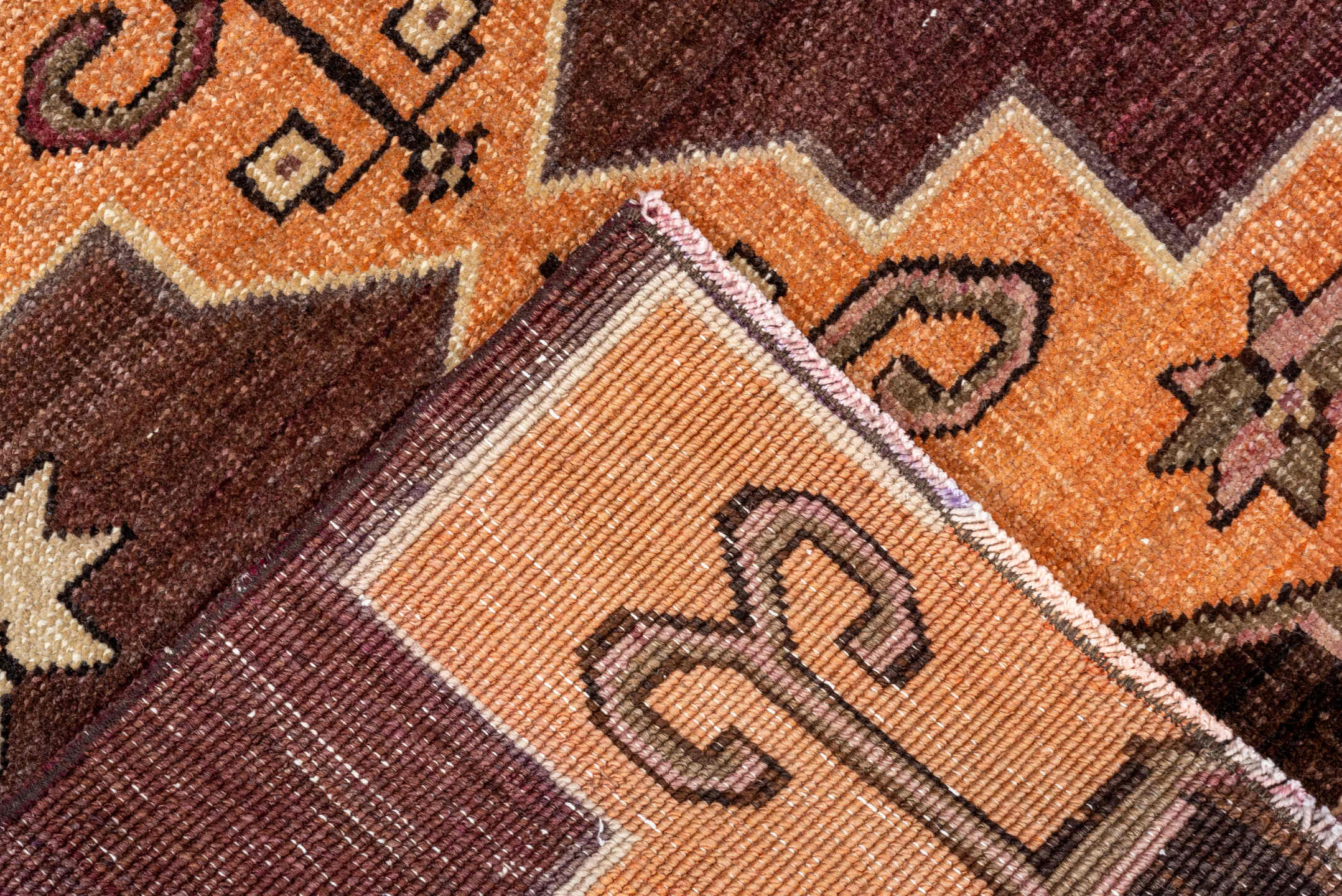 2' x 8' one-of-a-kind handmade vintage Kars runner rug. Color palette: brown, red, orange, pink, black, chocolate, redwood