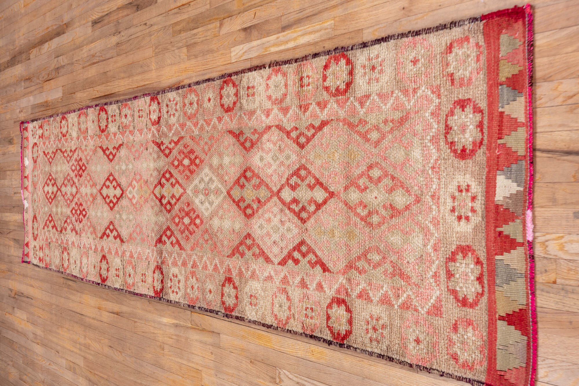 3' x 11' one-of-a-kind handmade vintage Oushak runner rug. Color palette: brown, indian red, off-white, orange, pink, red