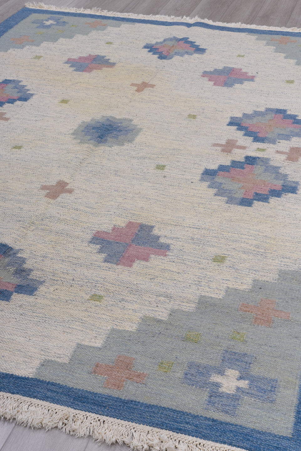 6' x 9' one-of-a-kind handmade vintage Rollaken medium size rug. Color palette: gray, blue, light gray, off-white, brown