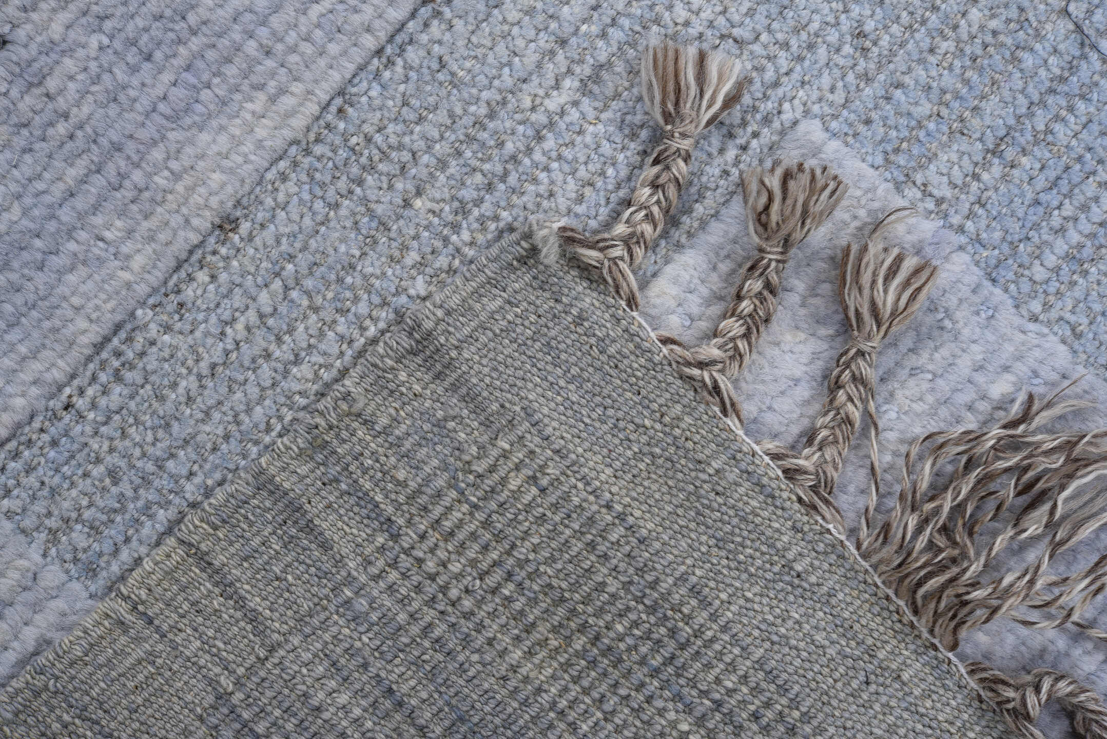 6' x 9' one-of-a-kind handmade vintage Tulu medium size rug. Color palette: brown, gray, light blue, light gray, off-white