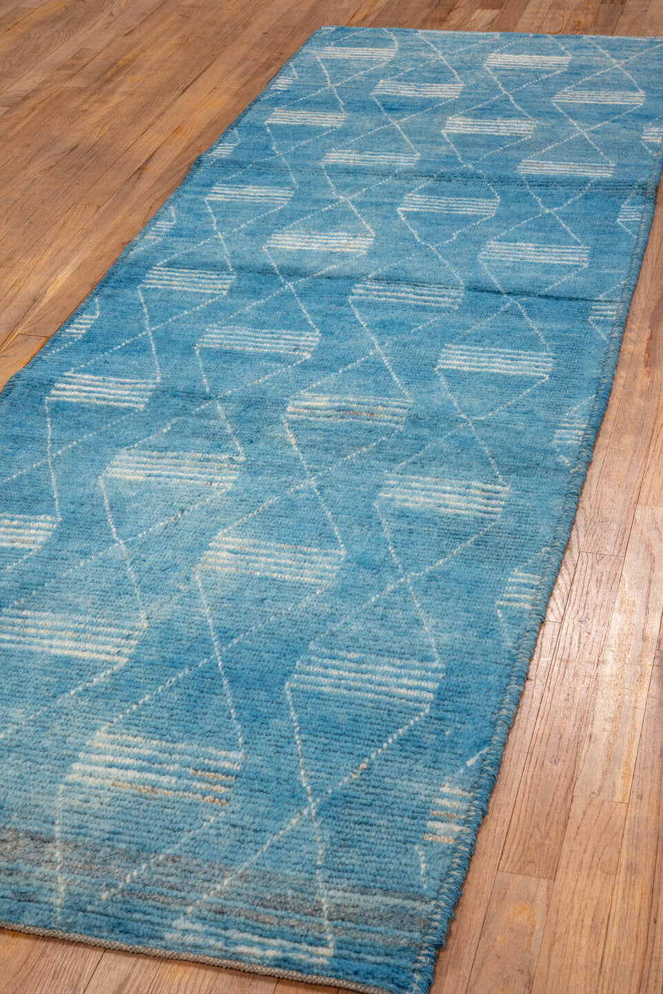 2' x 9' one-of-a-kind handmade vintage Tulu runner rug. Color palette: blue, gray, light gray, off-white, light blue, white