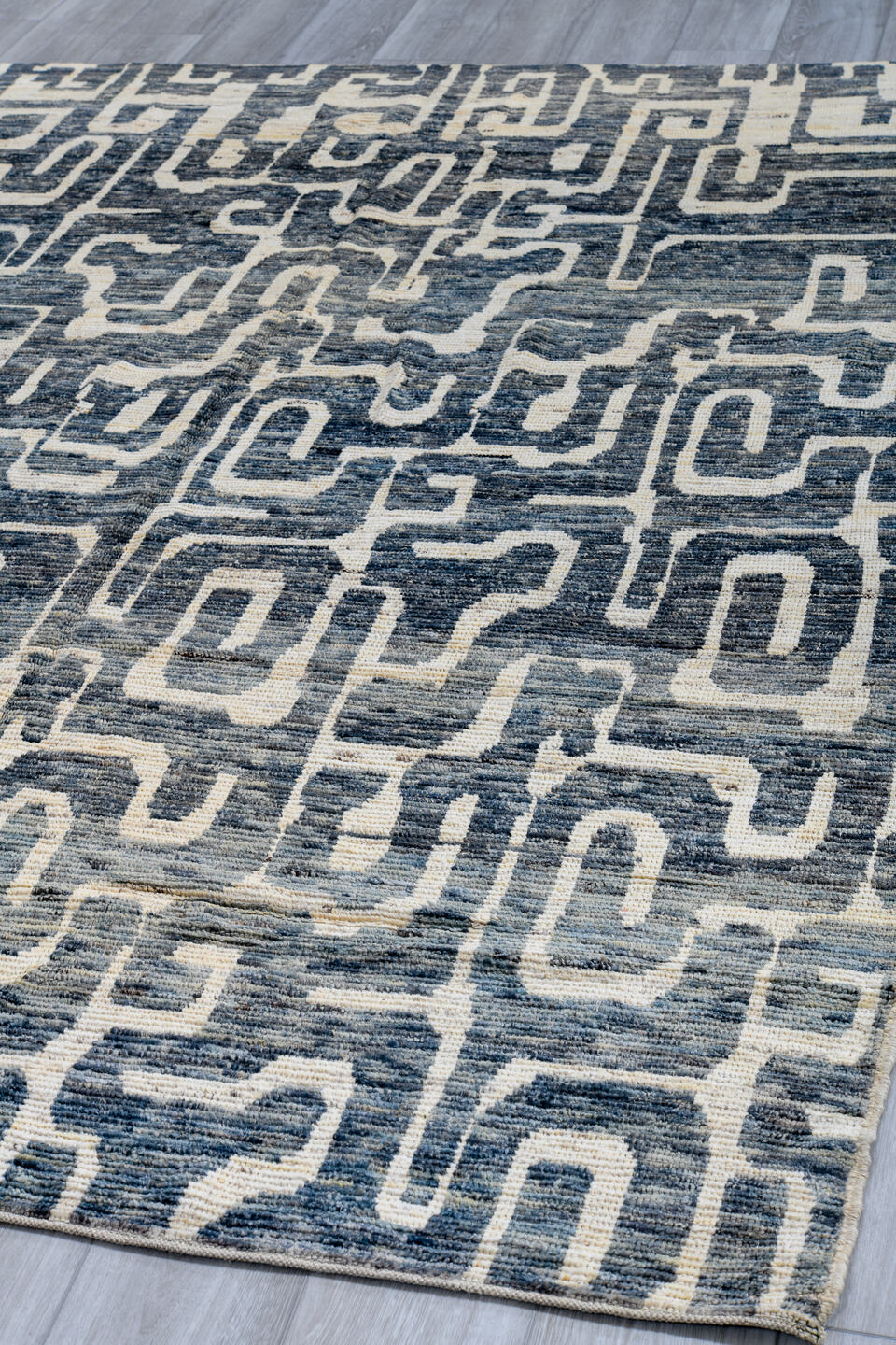 6' x 9' one-of-a-kind handmade vintage Tulu medium size rug. Color palette: arapawa, black, blue, brown, charcoal, dark gray