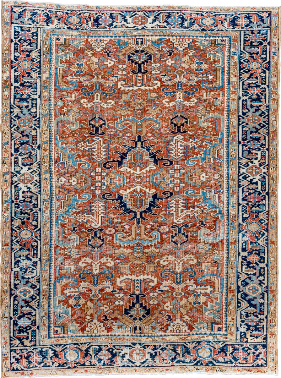 7' x 10' one-of-a-kind handmade vintage Heriz large size rug. Color palette: brown, gray, blue, orange, light blue, pink
