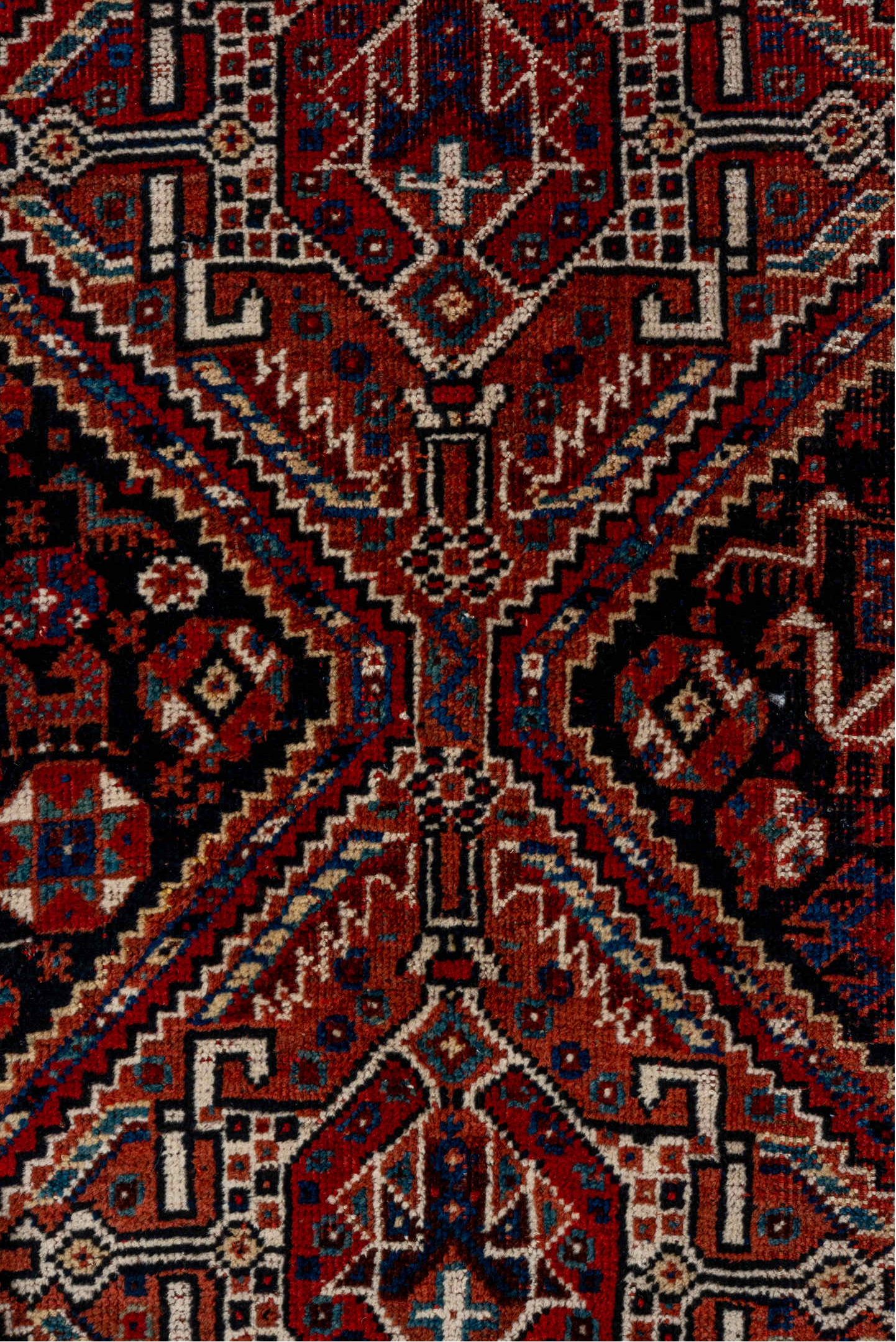 7' x 9' one-of-a-kind handmade vintage Shiraz rug. Color palette: gray, red, pink, brown, light gray, blue, off-white