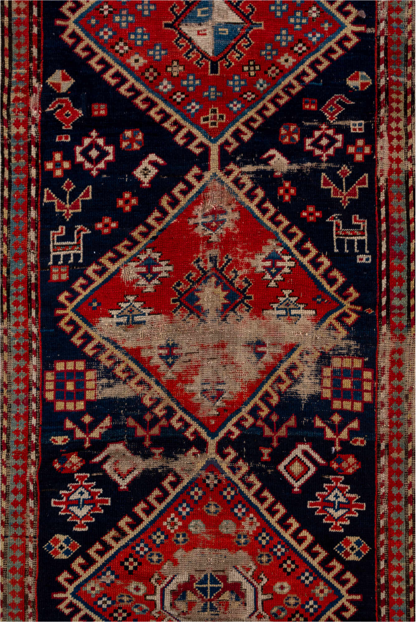 4' x 9' one-of-a-kind handmade vintage Shirvan runner rug. Color palette: blue, brown, gray, pink, red, redwood
