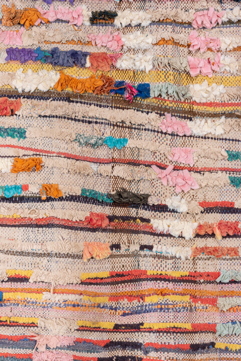 4' x 7' one-of-a-kind handmade vintage Rag Rug rug. Color palette: red, brown, gray, blue, pink, light gray, off-white