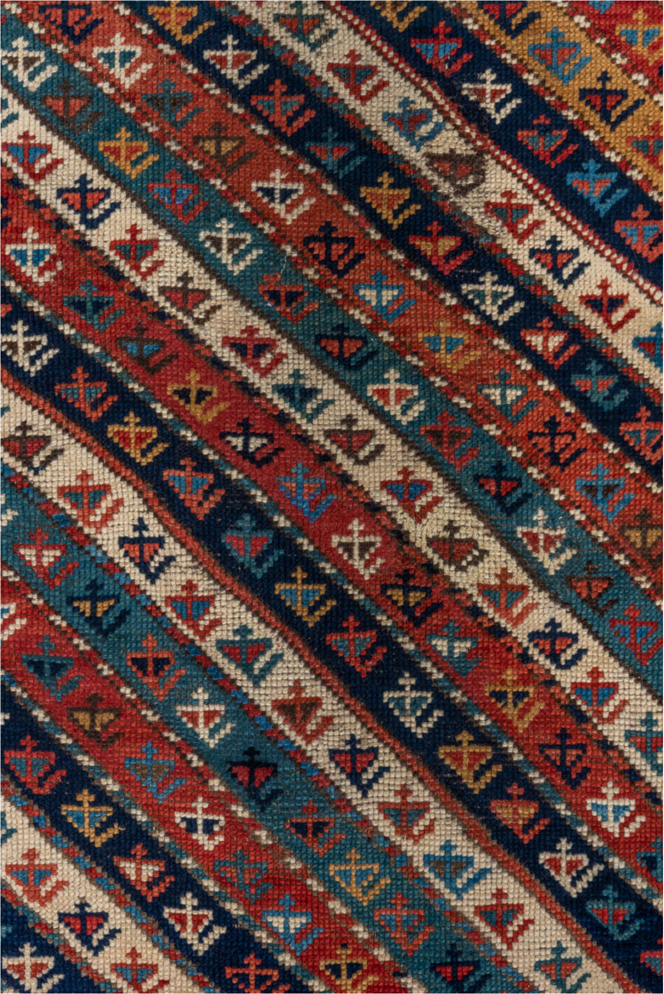 4' x 9' one-of-a-kind handmade vintage Kazak runner rug. Color palette: arapawa, black, blue, brown, gray, orange, red, tan