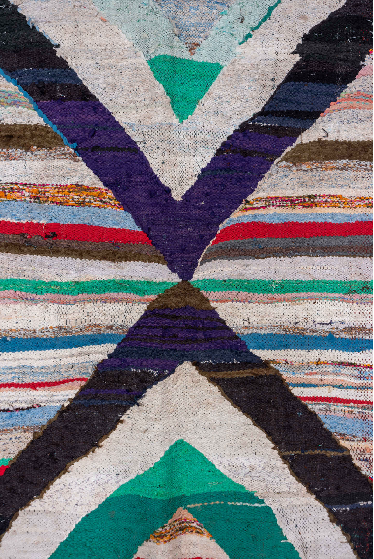 5' x 8' one-of-a-kind handmade vintage Rag Rug medium size rug. Color palette: gray, light gray, red, brown, blue, pink