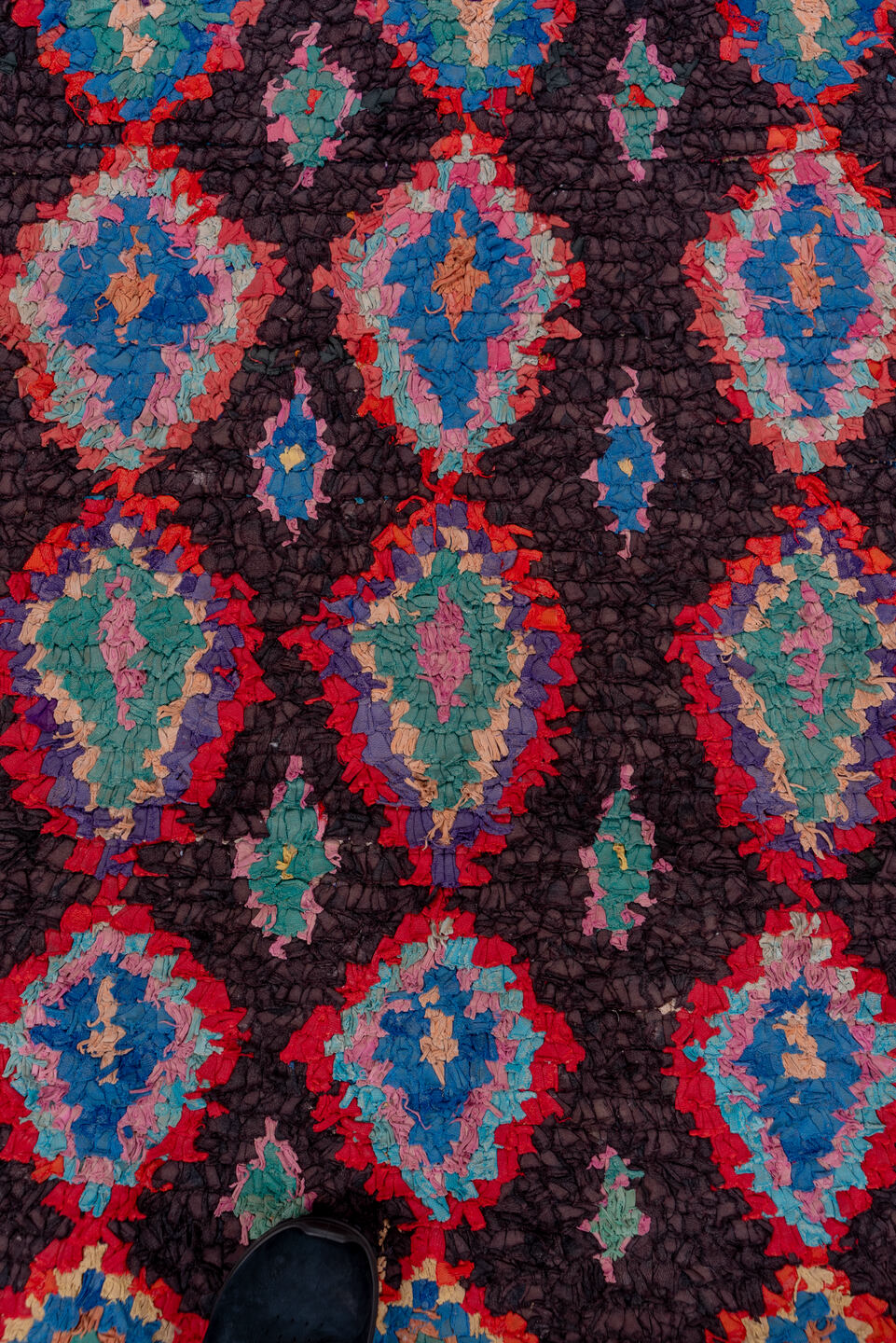 3' x 10' one-of-a-kind handmade vintage Rag Rug runner rug. Color palette: gray, brown, pink, red, blue, rosy brown